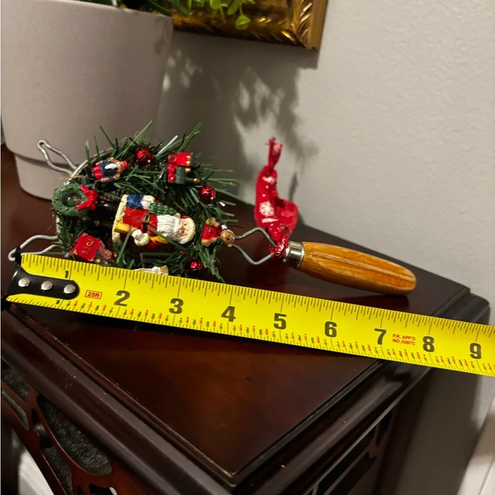Handmade Santa Holiday Wreath on an old tea strainer.